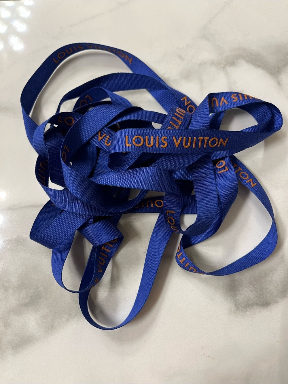 Louis Vuitton cobalt blue ribbon with orange logo